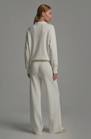 LORVENES knit trouser set featuring a cozy, textured knit fabric, with the model wearing the matching top and trousers in a neutral color.
