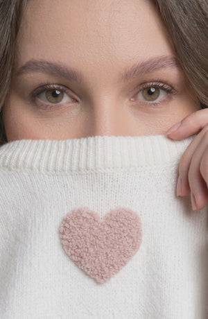 LORVENE Luxe Comfort sweater shown from the bottom right angle, soft knit fabric with ribbed hem and relaxed fit.