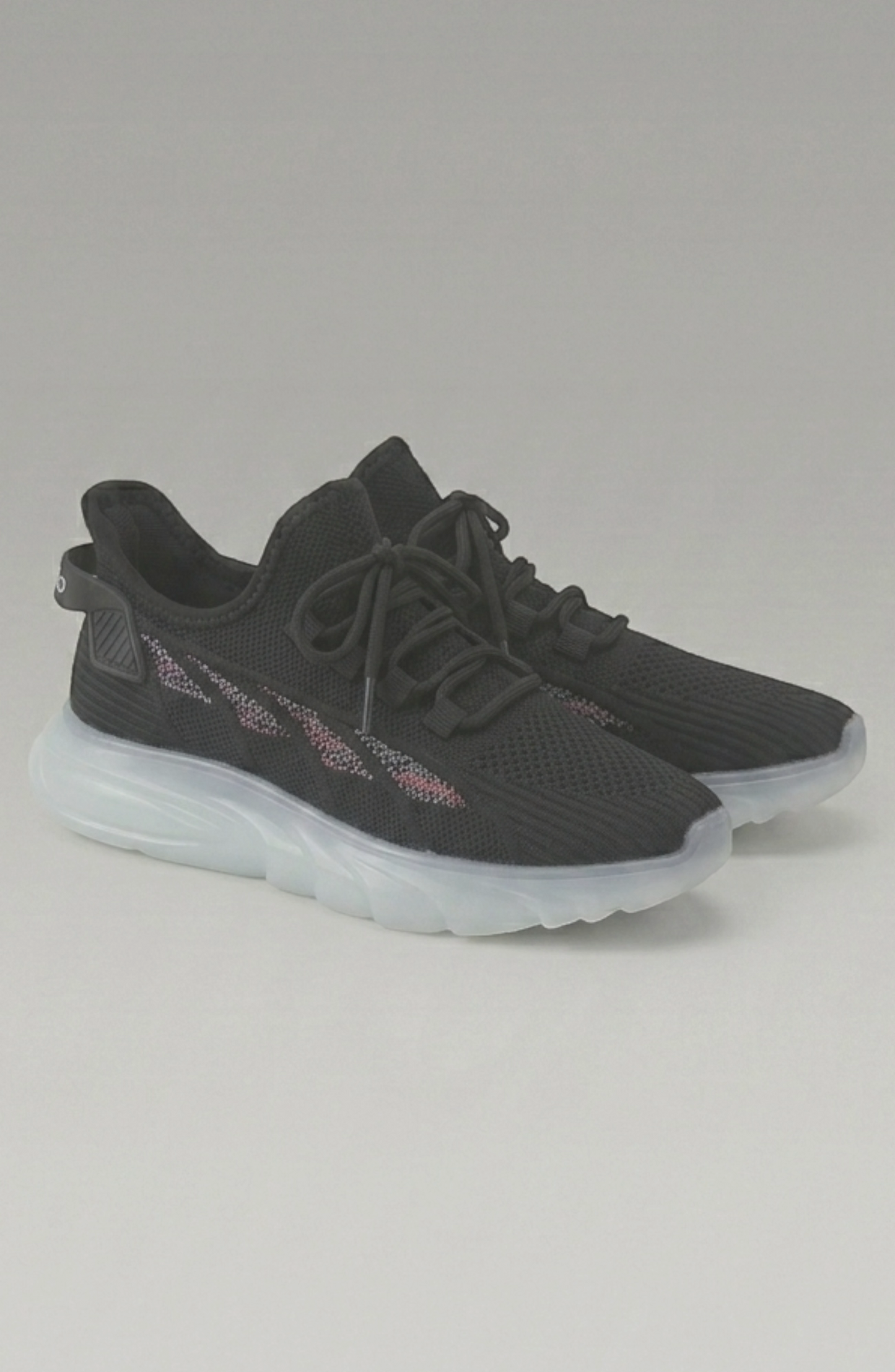 LORVENE Cloud Ease sneakers shown from a bottom right angle, featuring white and gray athletic shoes with cushioned soles.
