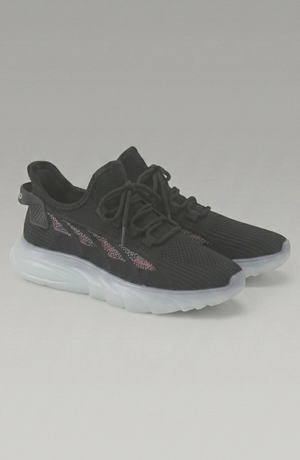 LORVENE Cloud Ease sneakers shown from a bottom right angle, featuring white and gray athletic shoes with cushioned soles.