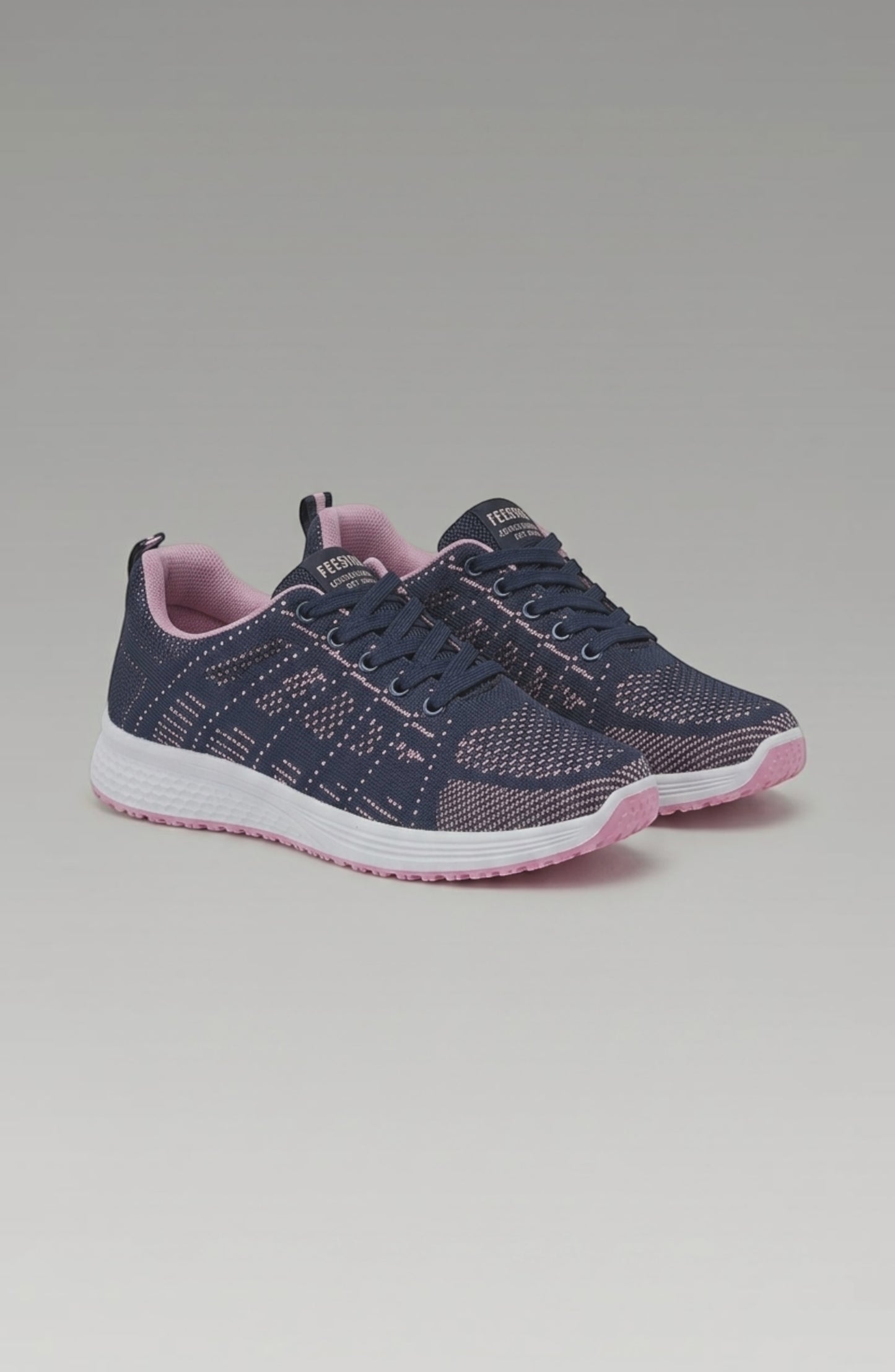 LORVENE Pure Storm sneakers with white sole and sleek black design, shown from a bottom right angle.