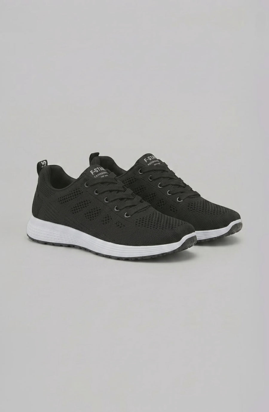 LORVENE Pure Storm sneakers shown from the bottom right angle, featuring sleek design and rubber sole in a modern athletic style.