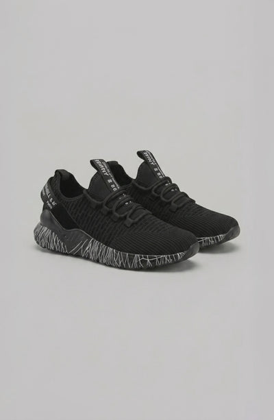 LORVENE Chrome Path sneakers shown from the bottom right angle, highlighting the stylish rubber sole and sleek design.