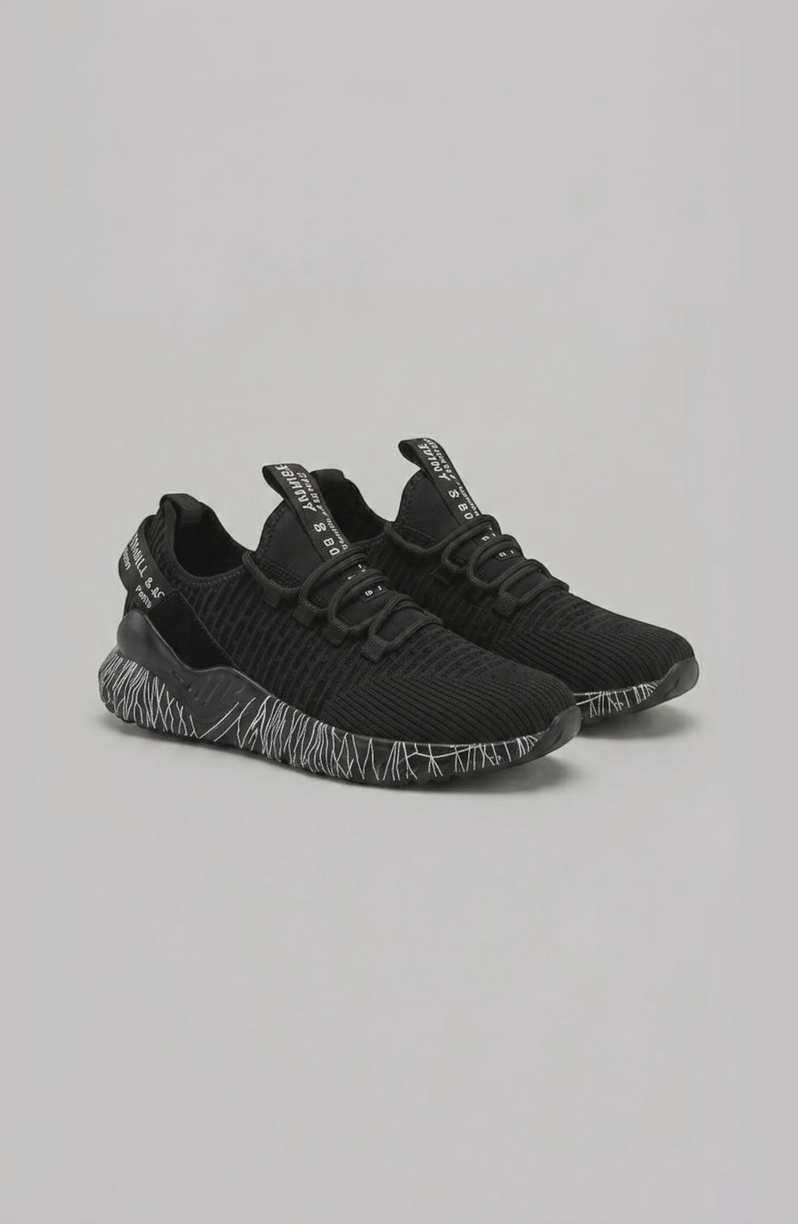 LORVENE Chrome Path sneakers shown from the bottom right angle, highlighting the stylish rubber sole and sleek design.