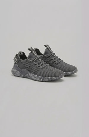 LORVENE Chrome Path sneakers showing the bottom right pose with sleek chrome accents and white rubber soles.