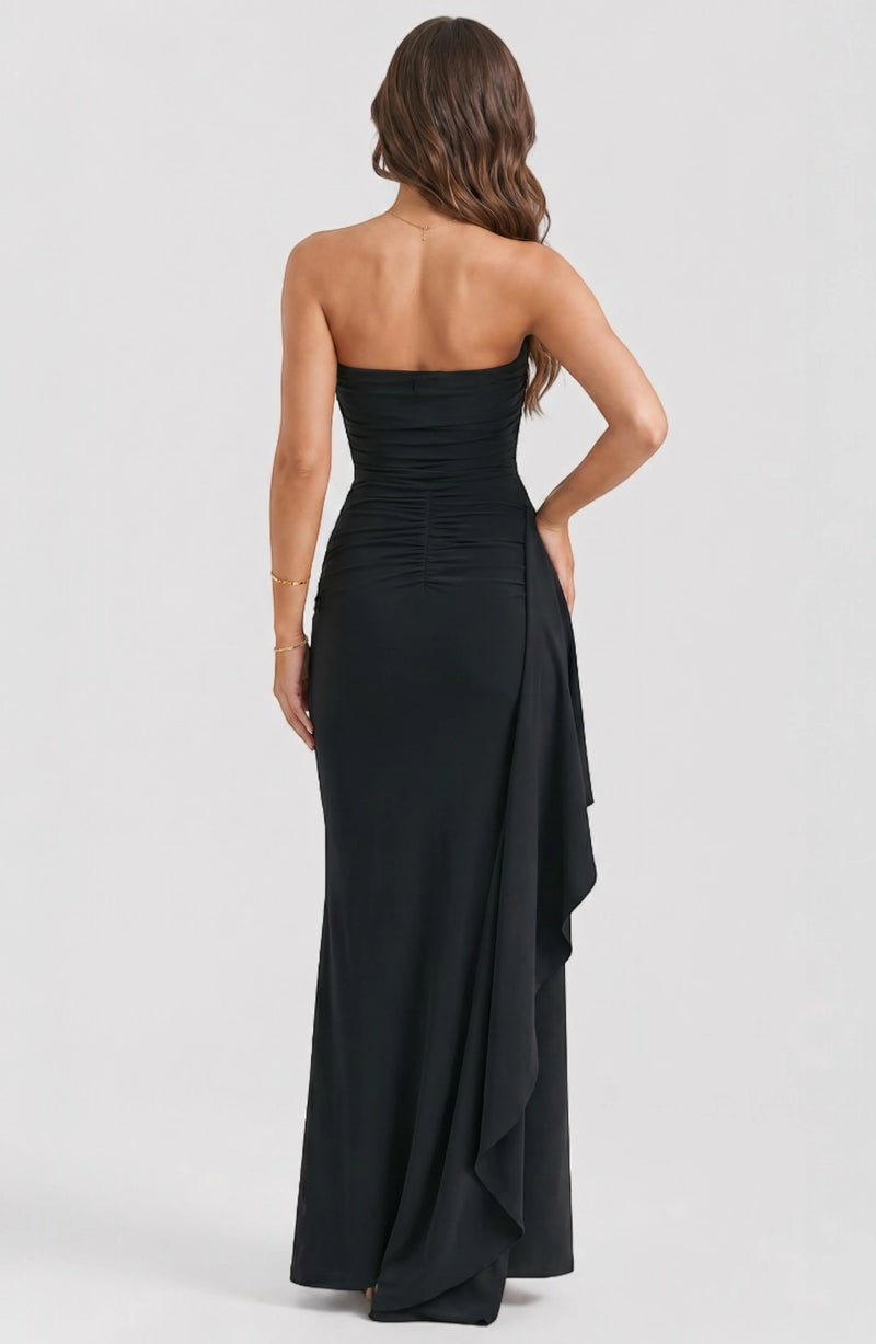 LORVENE Starry Luxe Dress displayed on a mannequin, featuring a dark fabric with starry embellishments and elegant design details.
