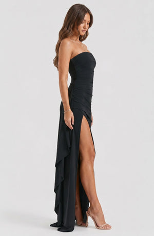 LORVENE Starry Luxe Dress featuring a flowing fabric with starry pattern and elegant design, displayed on a hanger.