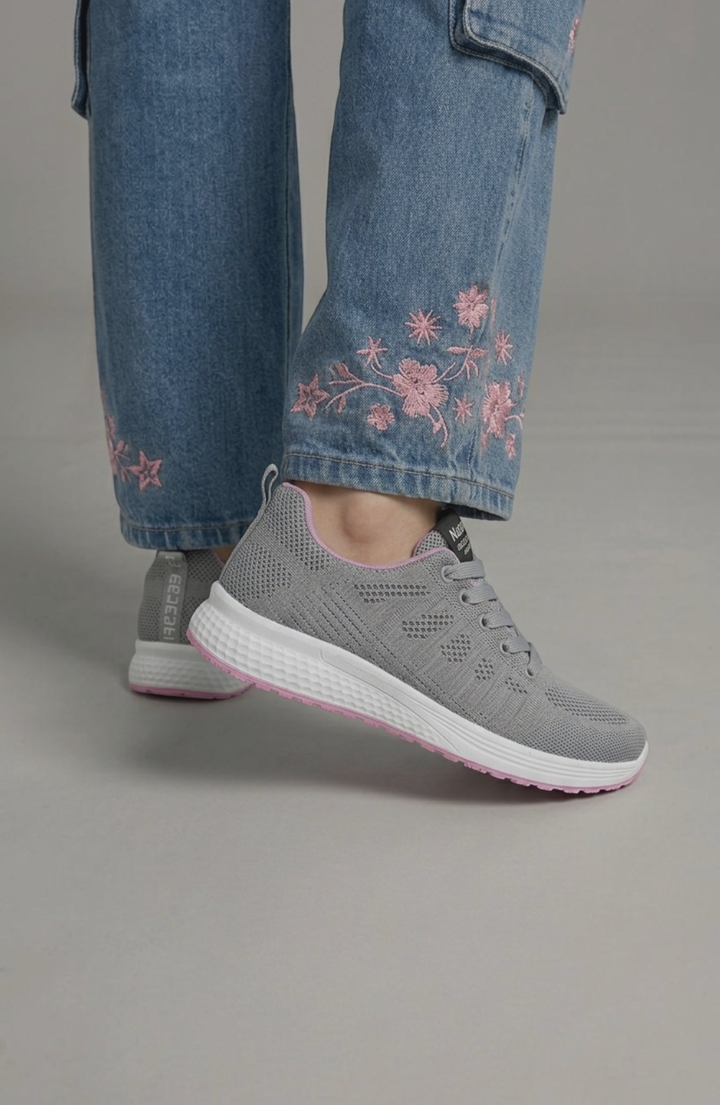 LORVENE Pure Storm sneakers in black with white soles, featuring sleek design and breathable fabric for casual wear.
