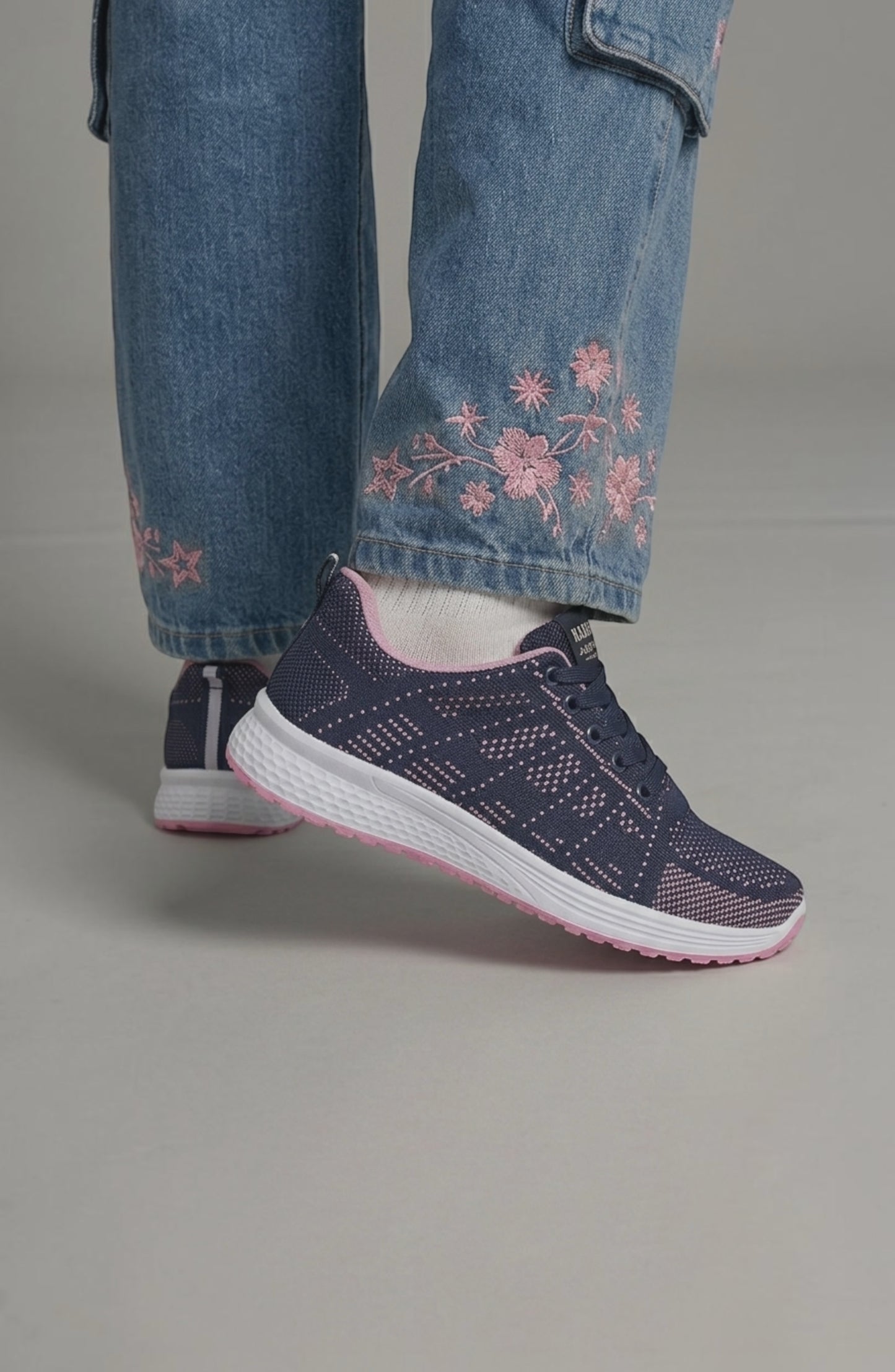 LORVENE Pure Storm sneakers in white with black accents, featuring a sleek design and comfortable athletic style.