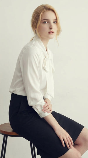 LORVENE double pocket shirt showing the top right section with two chest pockets and button details.