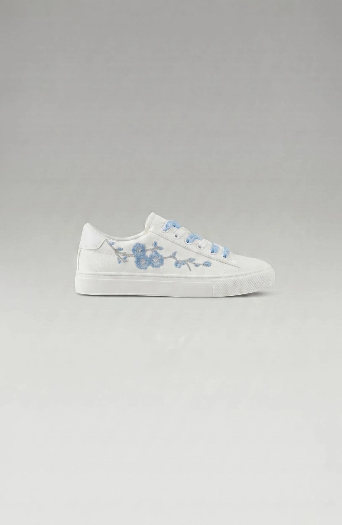 LORVENE Crystal Tone sneakers showing the back view with matching design and crystal accents on a neutral background.