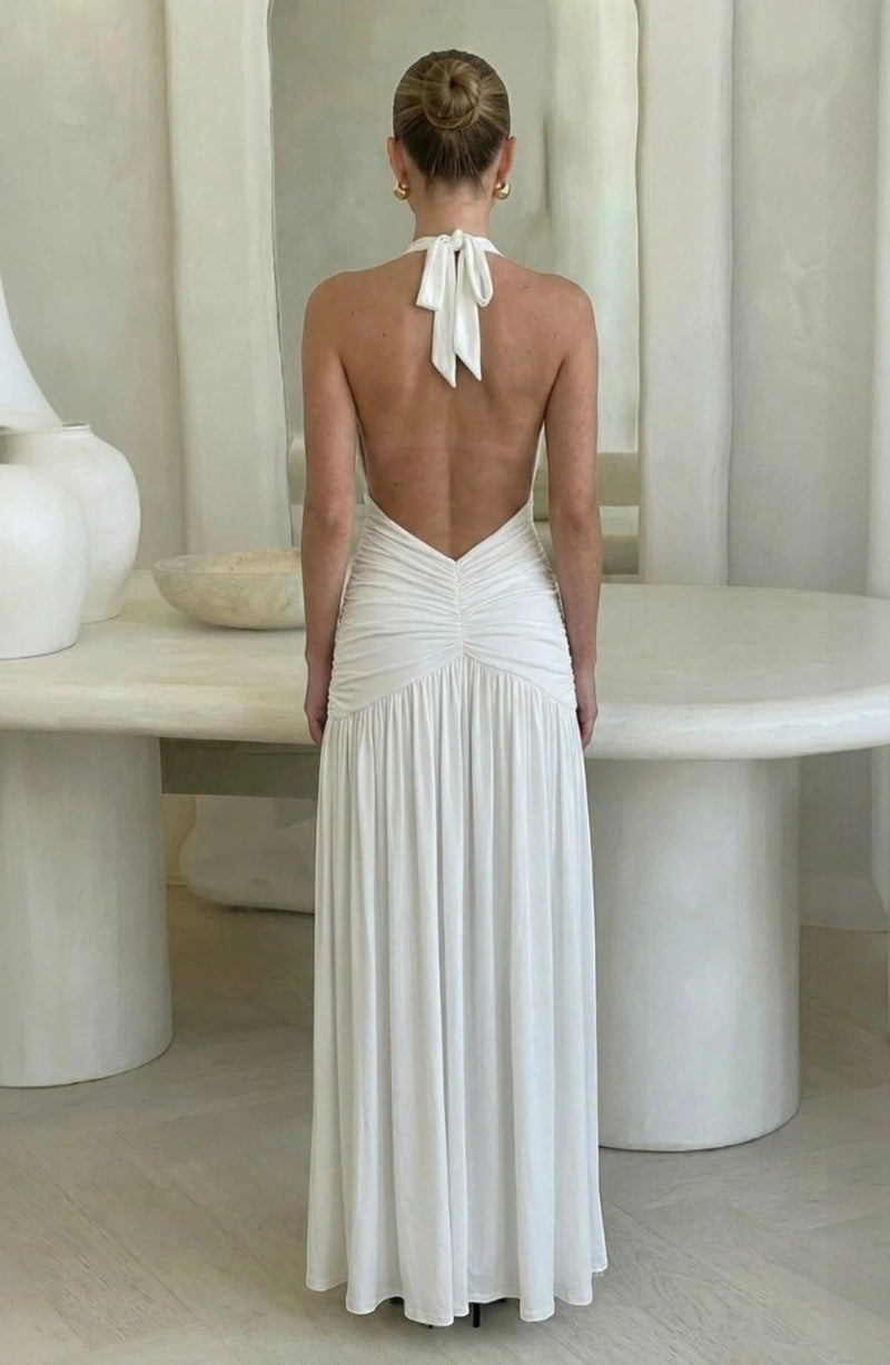 LORVENE white ruched halter neck maxi dress with a low back and flowing skirt, perfect for evening events.