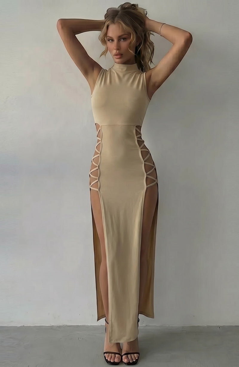 LORVENE beige sleeveless mock neck maxi dress with daring side cutouts and high slits, designed for evening wear.