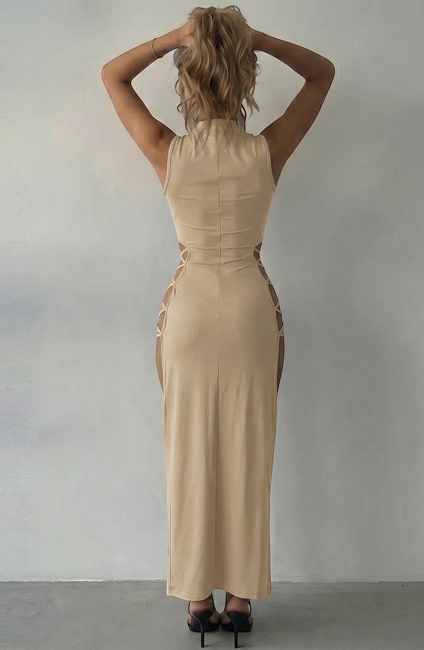 LORVENE beige sleeveless maxi dress with cut-out sides and mock neck, designed for evening wear.