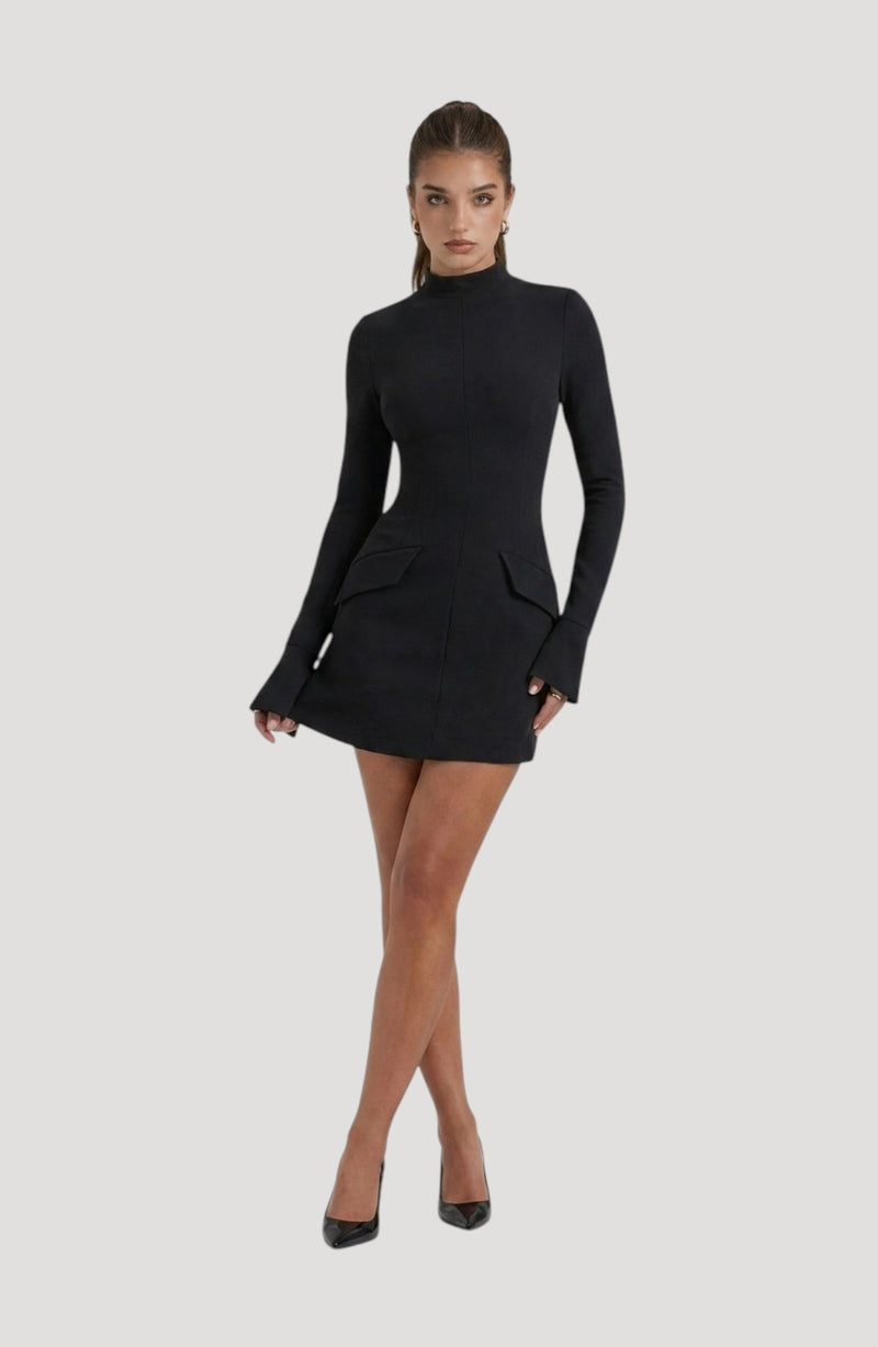 LORVENES black long-sleeve mock neck mini dress with flap pockets and flared cuffs, worn by a model with black heels.