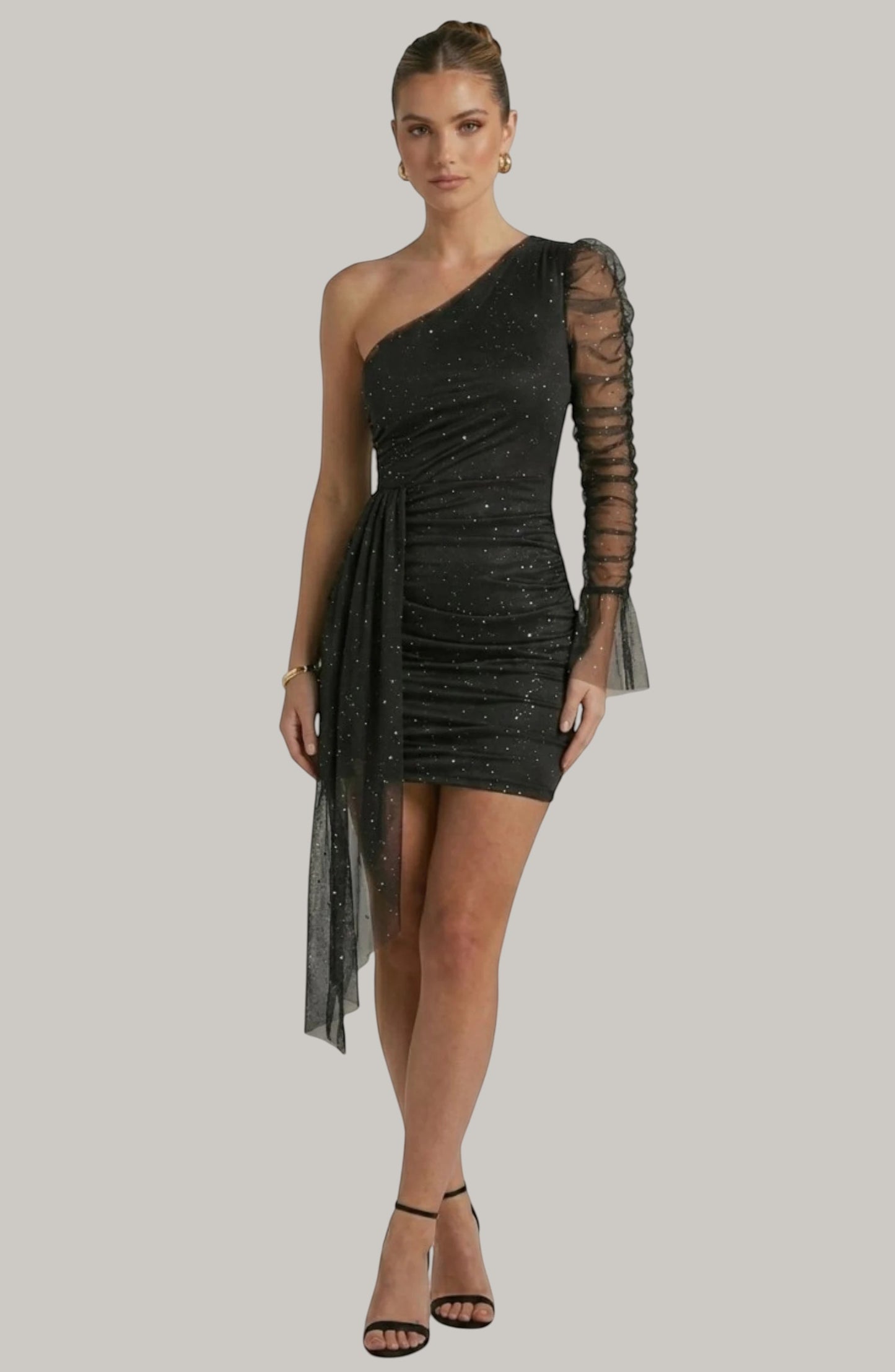 LORVENES black one-shoulder mini dress with ruched mesh sleeve and glitter detail. Draped fabric accent.