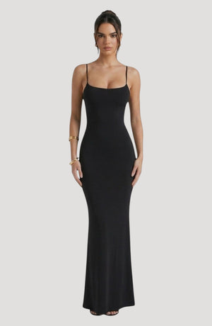 LORVENE black slip dress with spaghetti straps and a square neckline, midi length, made from smooth fabric with a sheen.