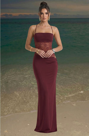 LORVENES burgundy maxi dress with lace midriff detail and spaghetti straps. Model wears gold jewelry.