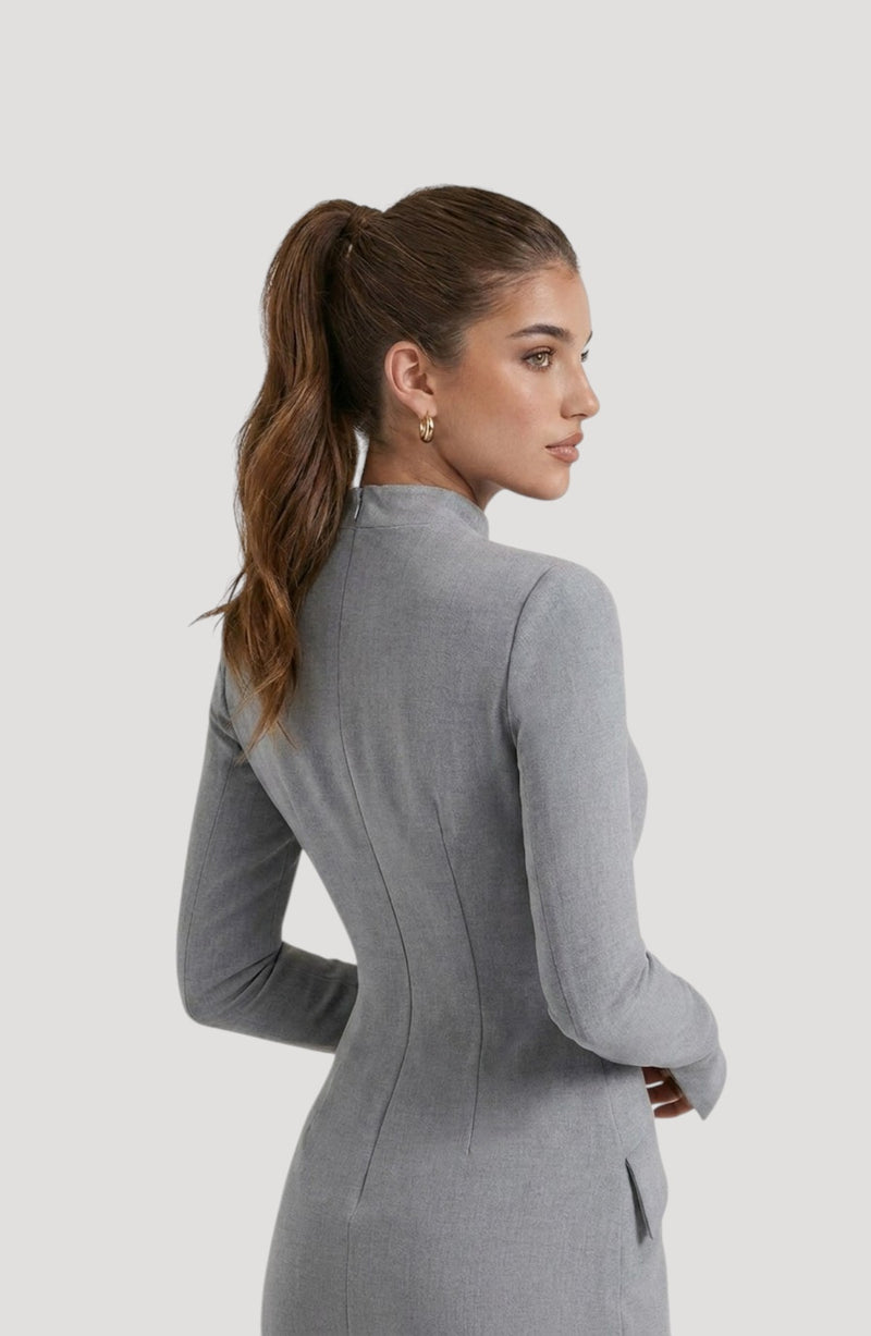 LORVENES grey long-sleeve mini dress with a high neckline, flattering fit, and subtle shimmer. Model wears gold hoop earrings.