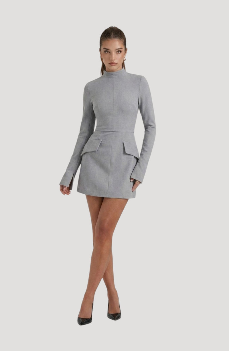 LORVENES grey long-sleeve mini dress with mock neck and flap pockets. Model wears black heels.