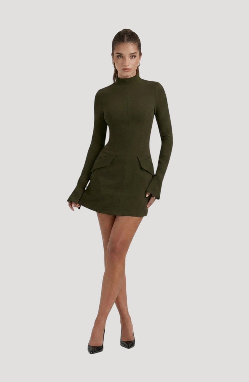 LORVENES olive green long-sleeve mini dress with mock neck and flap pockets. Model wears black heels.