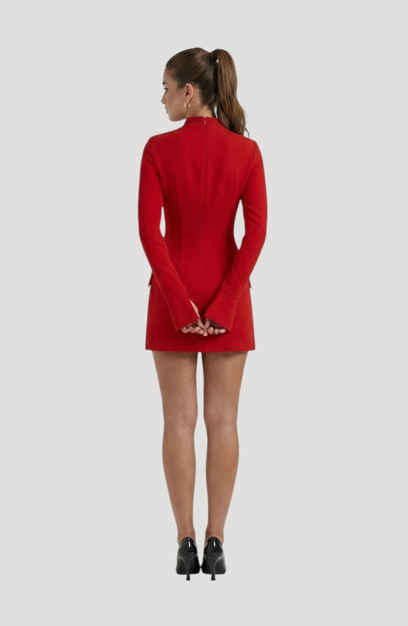 LORVENES red diamond party dress with long sleeves, mock neck, and mini length. Model wears black heels.
