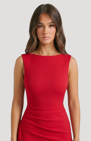 LORVENES red sleeveless boat neck formal evening frock with draped detailing and a flattering silhouette.