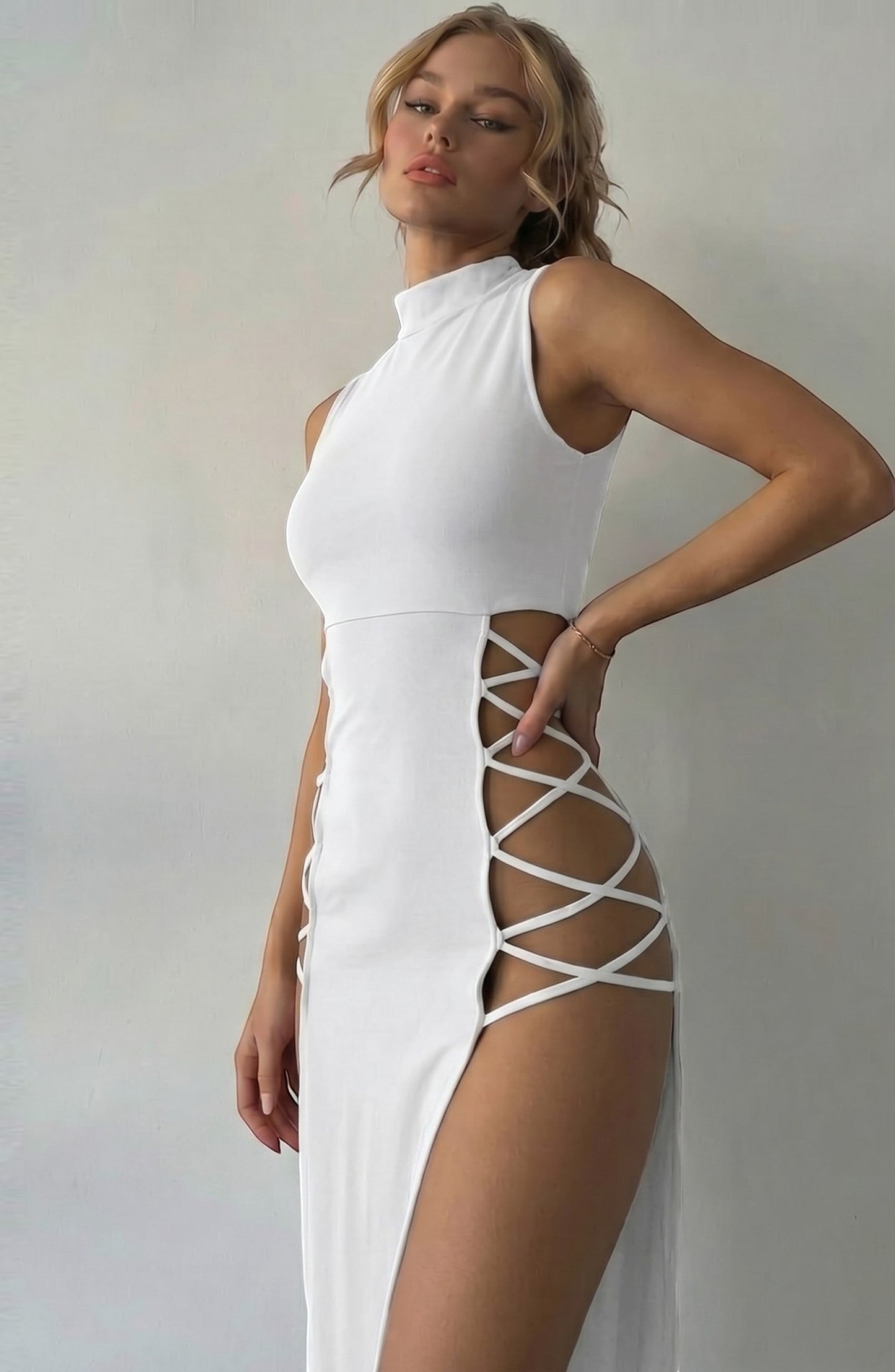LORVENE white sleeveless mock neck midi dress with lace-up side cutouts and high slit