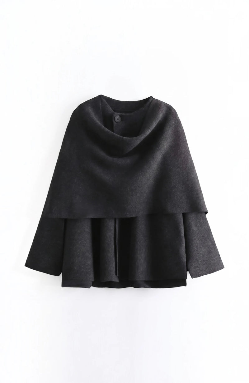 LORVENE cozy blanket shawl draped over a sofa, soft textured fabric in warm neutral tones, perfect for chilly evenings.