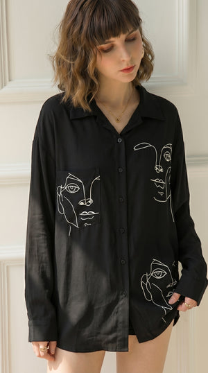 Black LORVENE double pocket shirt with button-up front and long sleeves, displayed on a hanger.