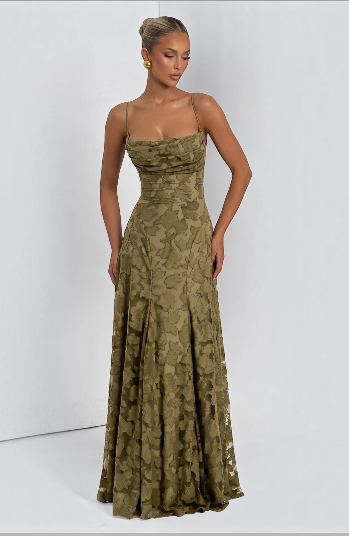 Elegant flowy bridal dress by LORVENES featuring a romantic silhouette and delicate fabric, perfect for a wedding ceremony.