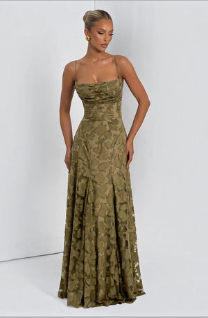 Elegant flowy bridal dress by LORVENES featuring a romantic silhouette and delicate fabric, perfect for a wedding ceremony.