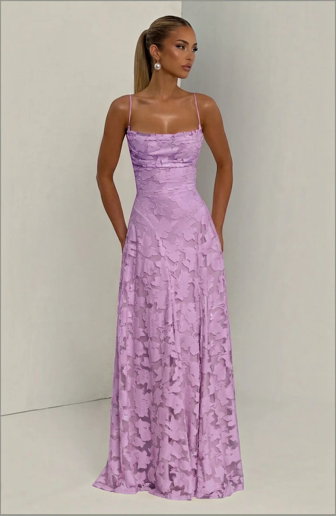 Elegant flowy bridal dress by LORVENES featuring a romantic design with lace details and a graceful silhouette.