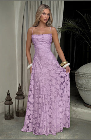 Elegant flowy bridal dress by LORVENES featuring delicate fabric and a flattering fit, perfect for a wedding ceremony.