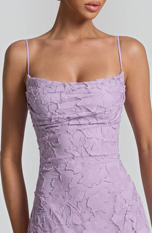 Elegant flowing bridal dress by LORVENES featuring a romantic silhouette and delicate fabric, perfect for a wedding gown.