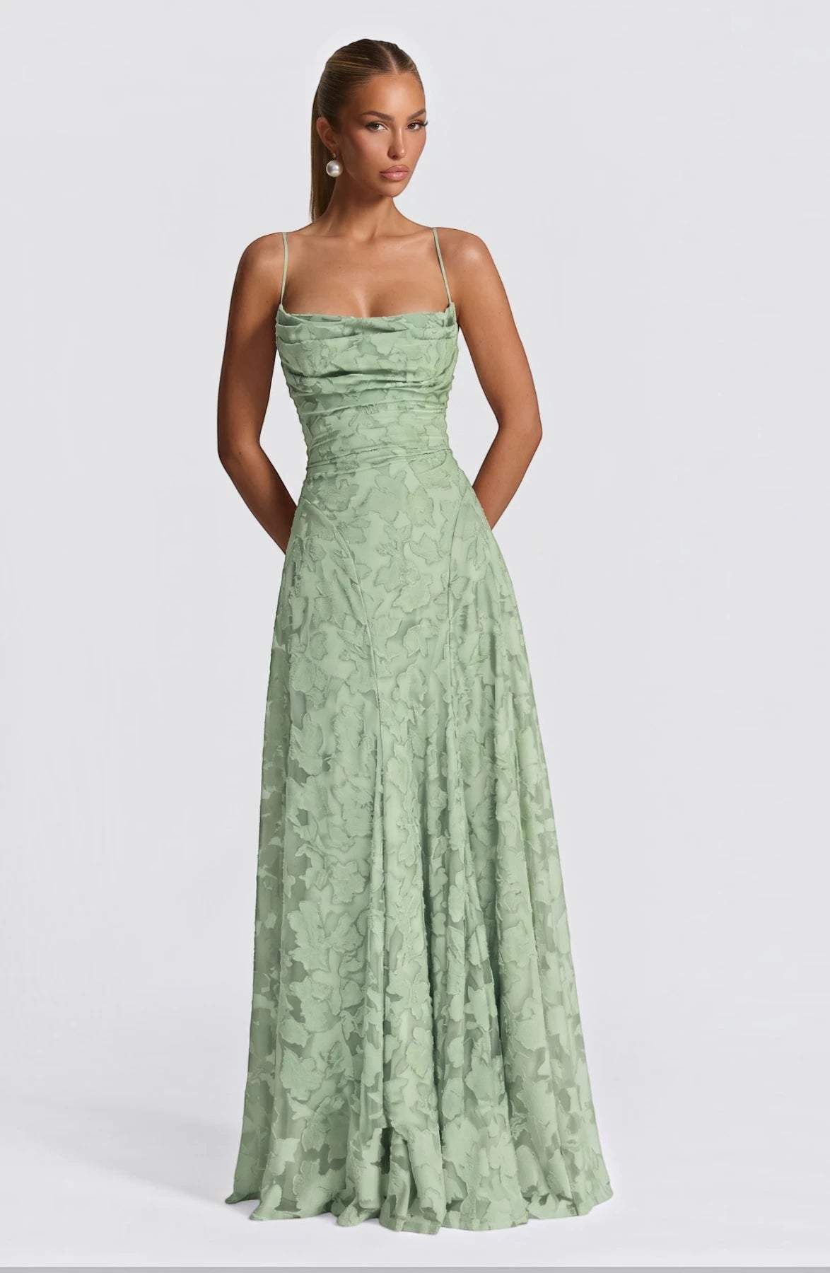 Elegant flowy bridal dress by LORVENES with delicate fabric and romantic silhouette, perfect for a wedding or special occasion.