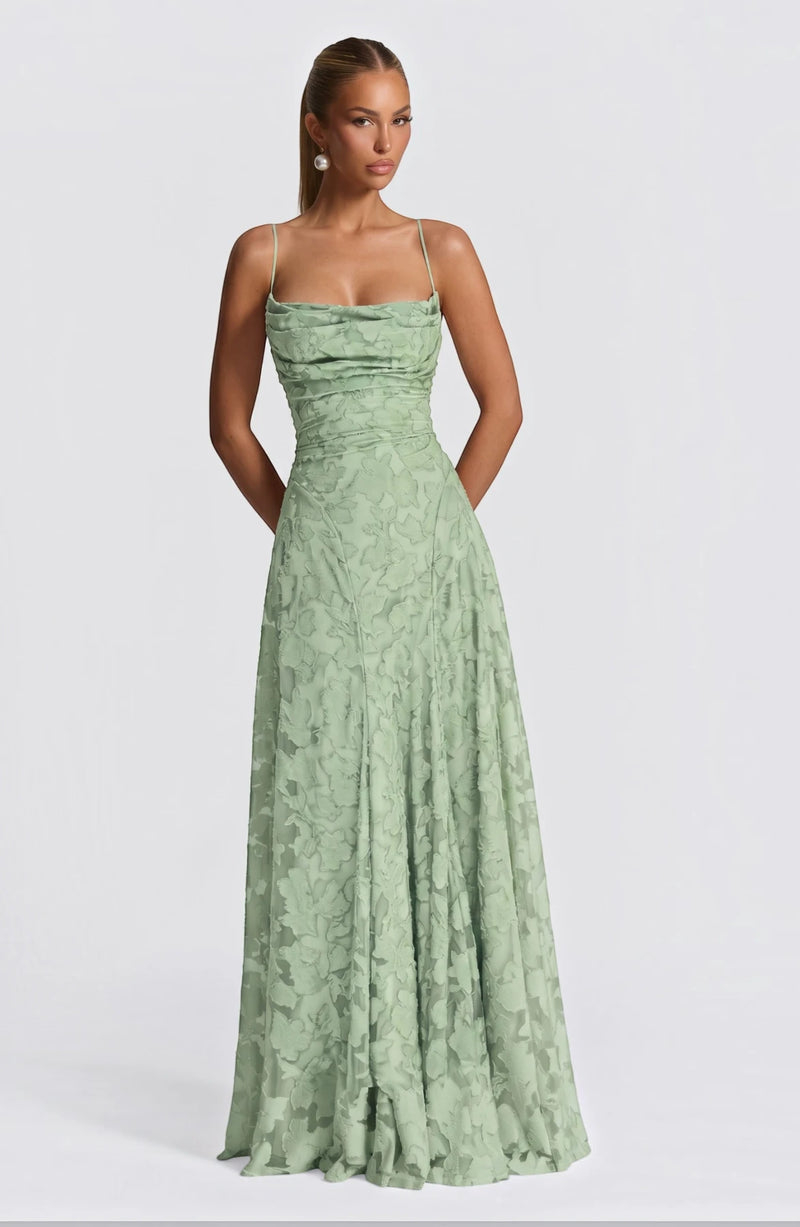 Elegant flowy bridal dress by LORVENES with delicate fabric and romantic silhouette, perfect for a wedding or special occasion.